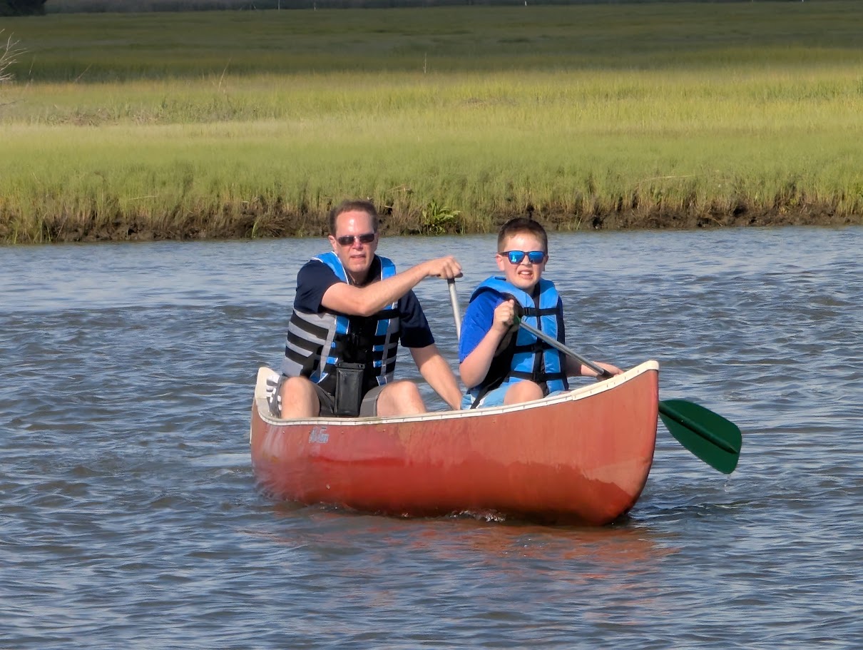 Scouts paddling a canoe during the 2026 East River trip.